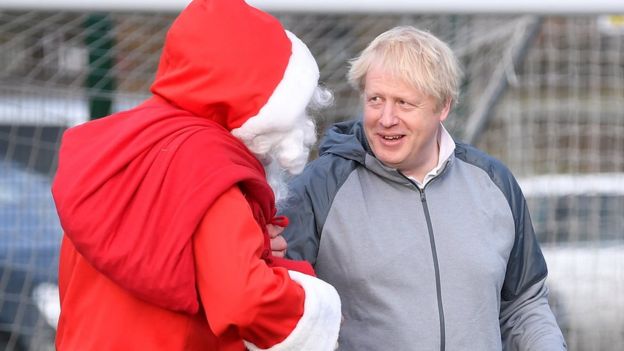 Boris Johnson jokes with Father Christmas in Cheadle Hulme