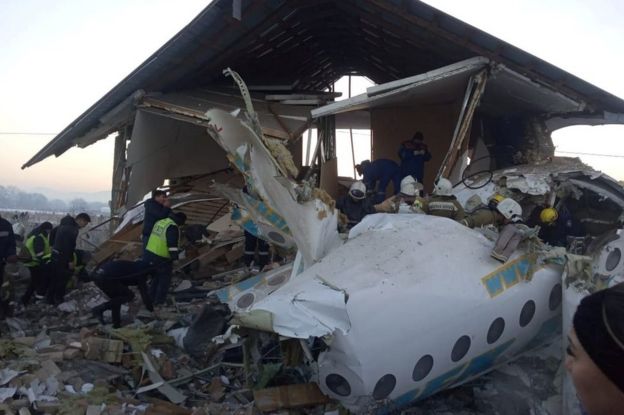 Emergency and security personnel are seen at the site of the plane crash near Almaty, Kazakhstan, December 27, 2019