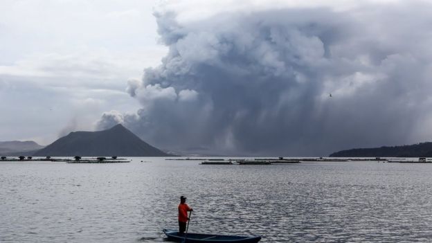The Taal Vocano in the Philippines erupts with a huge plume of ash