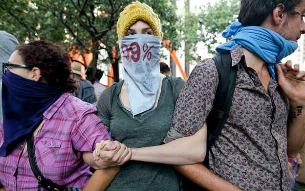 Protesters from Occupy LA in a rally in 2011. Sarah Mason, in a grey top, would later be featured on the cover of Time Magazine's Person of the Year.