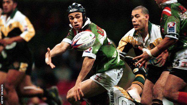 Travis Touma of Lebanon offloads during the 2000 Rugby League World Cup match against Cook Islands in Cardiff