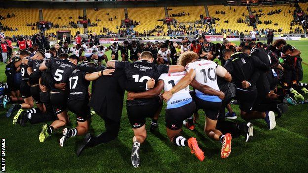 Fiji and New Zealand sing a joint hymn after their match