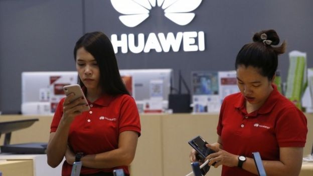 Shop assistants with Huawei products