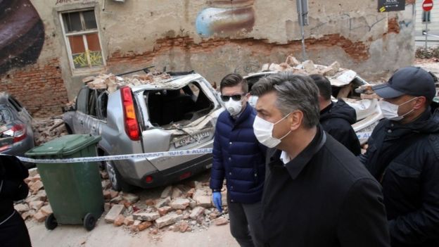 Croatian Prime Minister Andrej Plenkovic looks at the damage from the earthquake