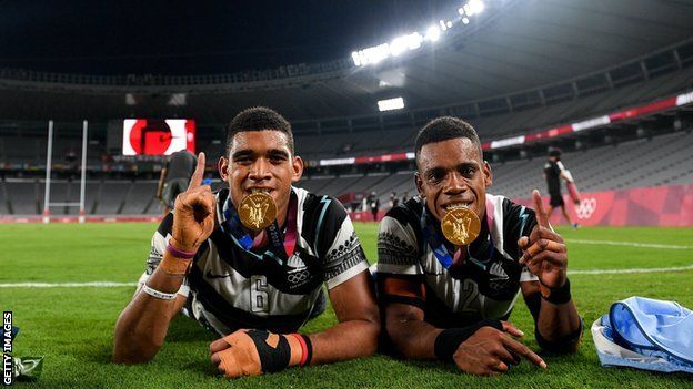 Meli Derenalagi, left, and Bolaca Napolioni of Fiji with their gold medals at the Tokyo Stadium during the 2020 Olympic Games
