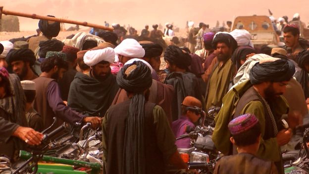 Image result for taliban in black turbans at a busy street market images