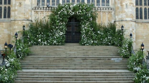 Flowers and foliage surround the West Door and steps of St George's Chapel at Windsor Castle