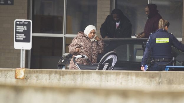 A woman from Djibouti is detained by Canada Border Services agents after arriving at the Canada-US border at Blackpool, Quebec, February 25 2017