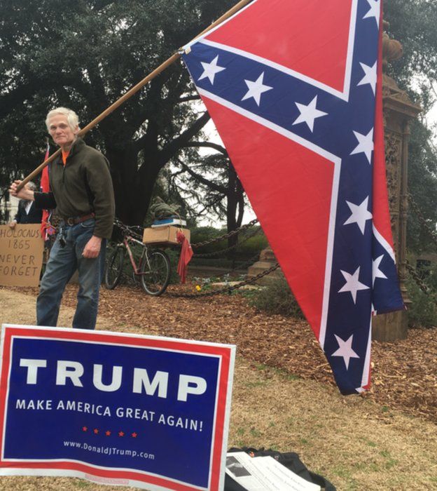 Confederate flag holder with Trump sign