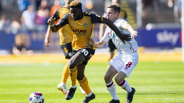 Offrande Zanzala of Newport County in action against Liam Kinsella of Walsall