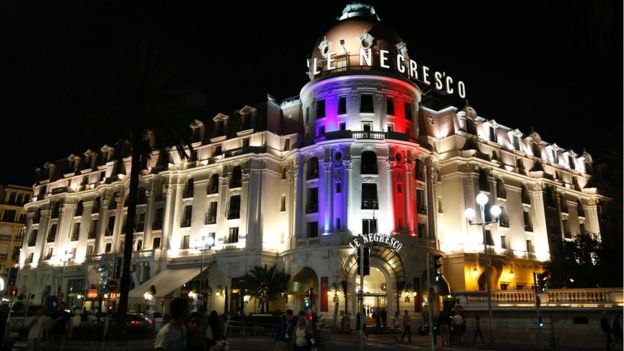 The Promenade des Anglais in Nice shows the Negresco hotel illuminated in the colours of France's flag in tribute to the victims of the Bastille Day attack, 17 July 2016