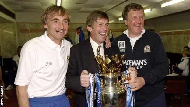 Dalglish the manager of Blackburn Rovers celebrates with his staff of Ray Harford and Tony Parkes after winning the Premiership trophy