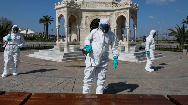 Municipal workers disinfect a public square in the Turkish city of Izmir