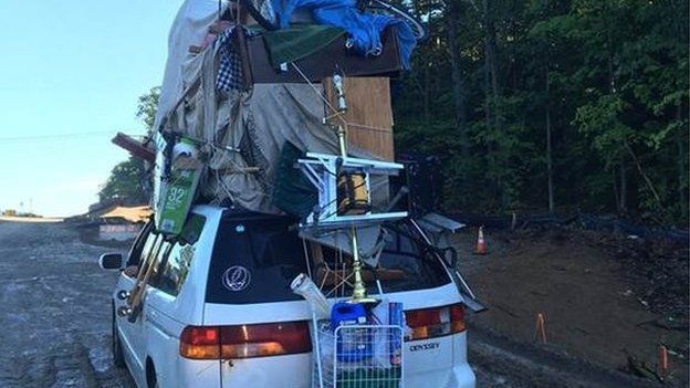 New Hampshire State Police post a photo of a van overloaded with household items like a table and other pieces of furniture.