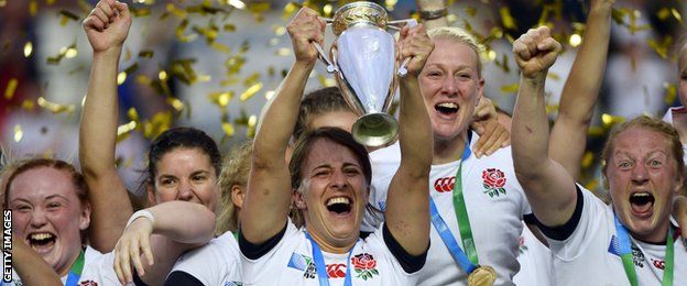 England's players celebrate with the trophy after winning the IRB Women's Rugby World Cup final match between England and Canada at the Jean Bouin Stadium in Paris on August 17, 2014. England won 21-9