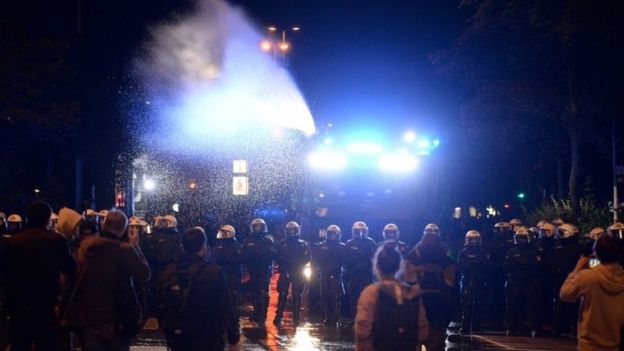 Germanpolice use water canon to disperse protesters in Hamburg. Photo: 5 July 2017