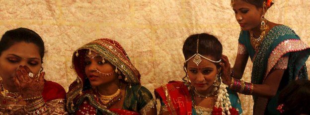 A Hindu bride and her party prepare as they wait for their wedding to start during a mass marriage ceremony in Karachi in Pakistan's Sindh province on 24 January 2016