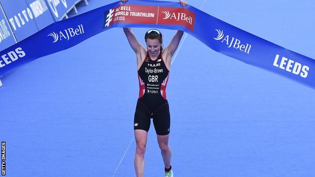 Britain's Georgia Taylor-Brown crosses the line first to win the World Triathlon Series in Leeds in June 2019