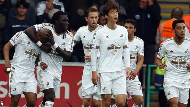 Swansea players celebrate Andre Ayew's opening goal