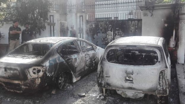 Burned out vehicles near the Chinese consulate in Karachi