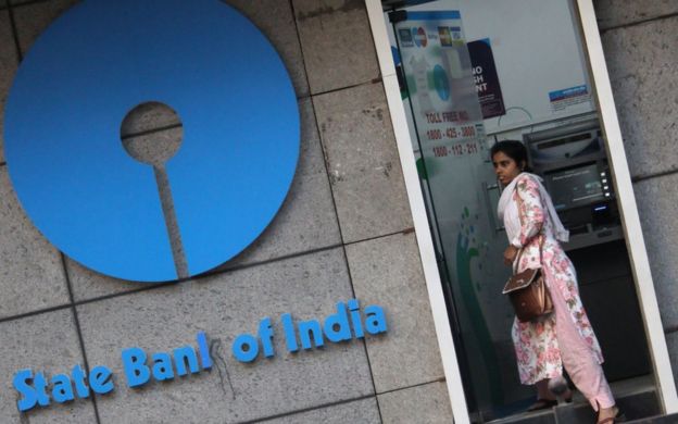 A woman walks out of an ATM of State Bank of India (SBI) in Mumbai, India on 07 February 2020.