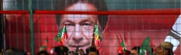 Supporters of Imran Khan, head of Pakistan Tehrik-e-Insaf (PTI) political party listen to his speech, during an election campaign in Karachi, Pakistan, 22 July 2018.