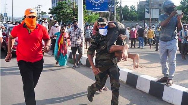 Rescuers evacuate people following a gas leak incident at an LG Polymers plant in Visakhapatnam on May 7, 2020. incident at an LG Polymers plant in Visakhapatnam on May 7, 2020