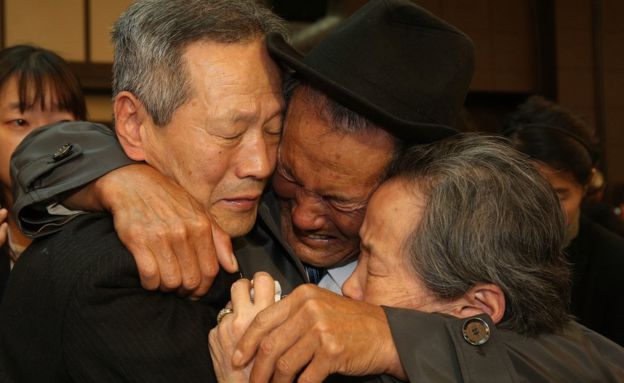 North Korean Son Gwon-Geun (C) cries with his South Korean relatives as they bid farewell following their family reunion on October 22, 2015 in Mount Kumgang, North Korea.