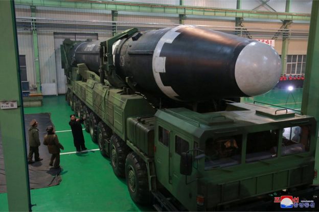 North Korea's leader Kim Jong Un is seen as the newly developed intercontinental ballistic rocket Hwasong-15's test was successfully launched, in this undated photo released by North Korea