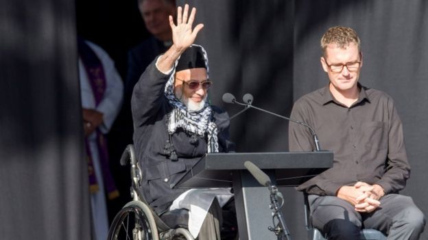 Farid Ahmed, a survicor of the Christchurch shooting, waving to the crowd at the remembrance service on March 29