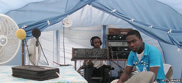 Staff of a local radio station broadcasting from a tent in quake-hit city of Jacmel