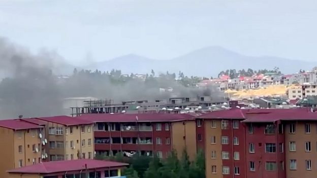 Smoke rises over Addis Ababa skyline during protests following the fatal shooting of the Ethiopian musician Hachalu Hundessa, in Addis Ababa, Ethiopia June 30, 2020, in this screengrab taken from a video