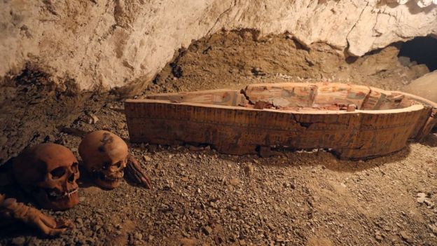 Skulls and hands are seen next to coffin in the recently discovered tomb of Amenemhat, a goldsmith from the New Kingdom, at the Draa Abu-el Naga necropolis