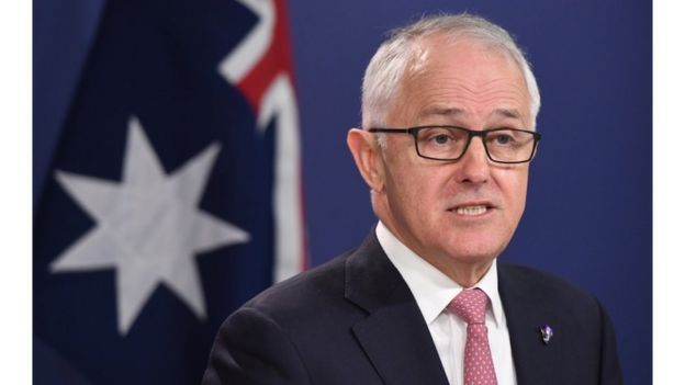 Malcolm Turnbull in front of an Australian flag