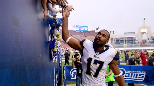 Robert Woods of the Los Angeles Rams celebrates a 33-7 win over the Houston Texans with fans at Los Angeles Memorial Coliseum