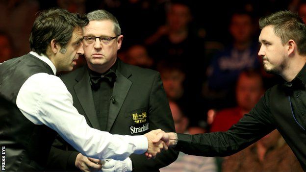 Ronnie O'Sullivan and Kyren Wilson shake hands before their encounter in Belfast on Wednesday