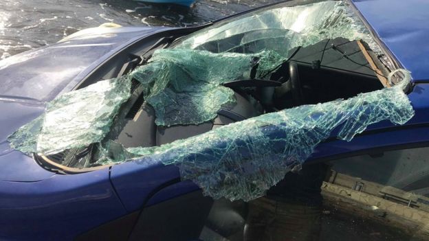 A smashed windscreen on the car which was found in the harbour
