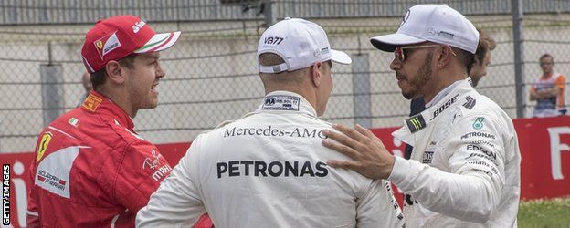 Sebastian Vettel and Lewis Hamilton shake hands after qualifying