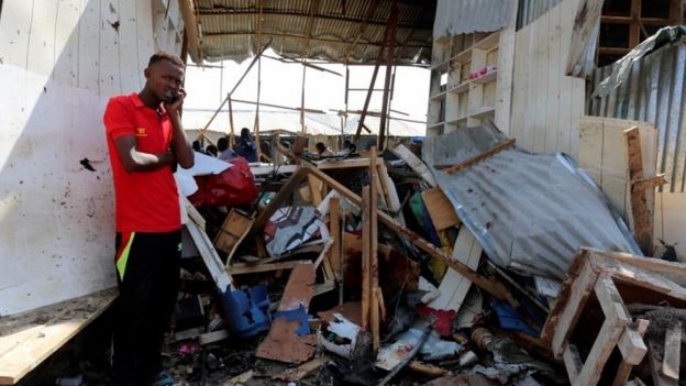 A Somali trader stands outside his destroyed shop near the scene of the explosion (19 February 2017)