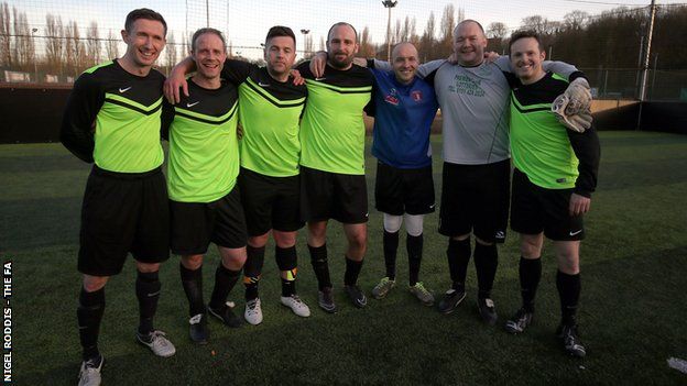 Harraby Catholic celebrate their Male Vets win in Leeds
