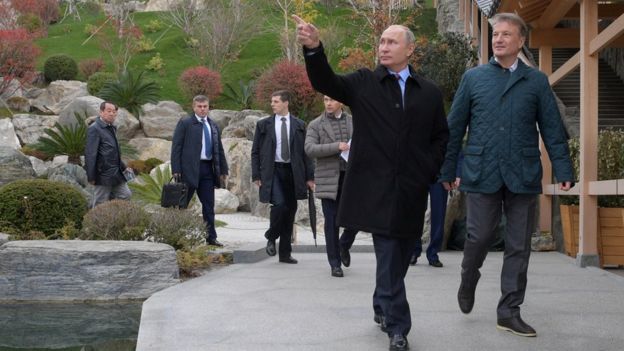 Russian President Vladimir Putin accompanied by Chief Executive of Sberbank German Gref while visiting Mria hotel in Yalta, Crimea November 23, 2018