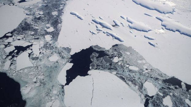 Sea ice floats around a group of islands as seen from NASA's Operation IceBridge research aircraft off the coast of the Antarctic Peninsula region