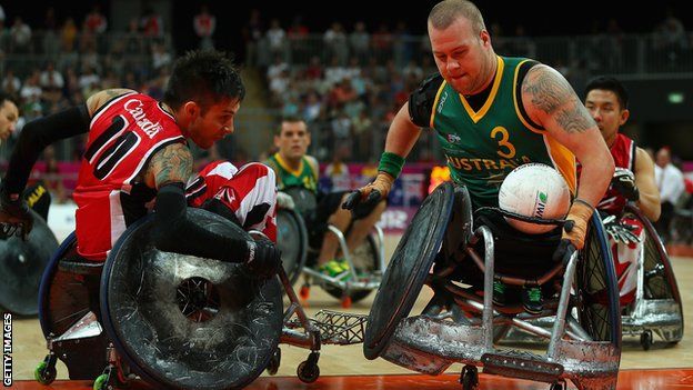 Riley Batt of Australia battles with Canada in wheelchair rugby
