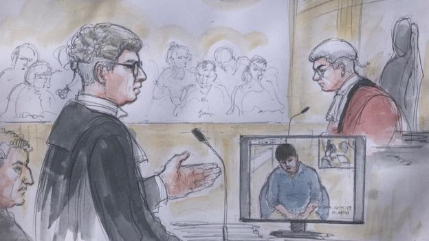 Sketch at Newcastle Crown Court of prosecutor Tony Badenoch QC with the defendant Carl Beech seen on screen during an interview he gave to police in 2014