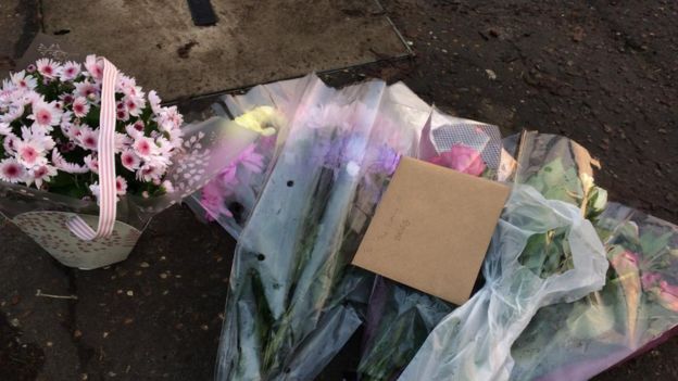 Flowers and messages at the scene