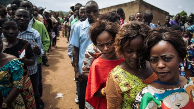 Voters queue to cast their ballots at a symbolic polling station on December 30, 2018, at Malepe Stadium in Beni,