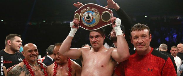 Joseph Parker smiles as he holds up the WBO world championship belt following a successful defence