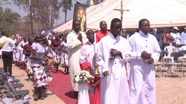 The memorial and opening of the cause for canonisation begins.