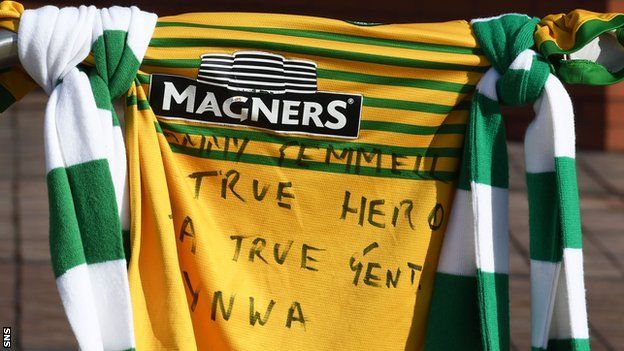 A Celtic shirt with a tribute to Tommy Gemmell outside Celtic Park