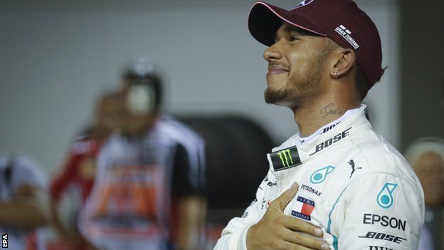 Mercedes' Lewis Hamilton celebrates after taking pole at the Singapore Grand Prix